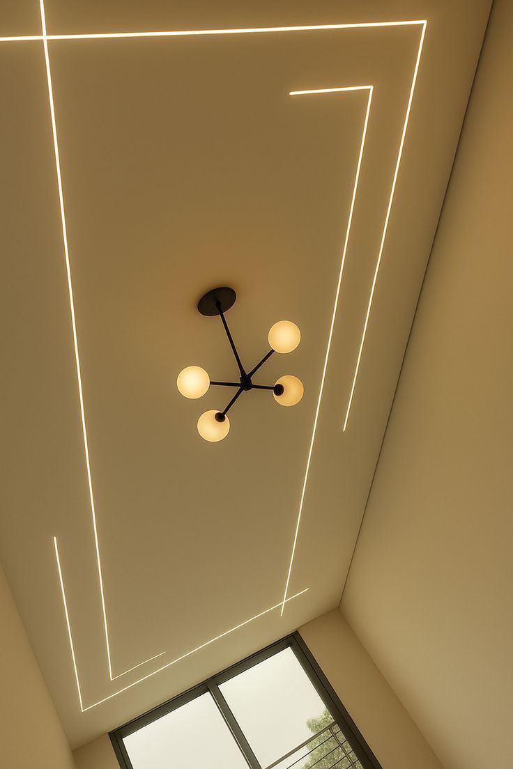 Pristine completed architectural ceiling with glowing embedded LED aluminum profiles and warm ambient light design by Dynawatt Engineering in Kampala, Uganda